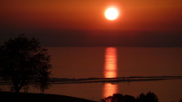 sunset bodensee with the bregenzer bucht and the rheindamm