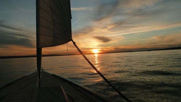 sunset bodensee with the sailboat