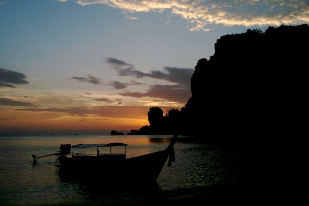 sunset in thailand on thonsai beach