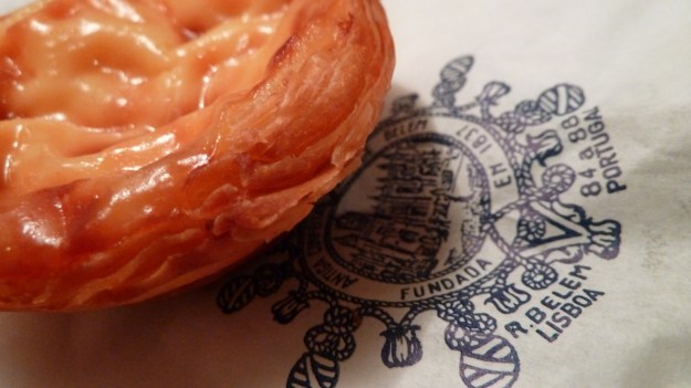 Pastéis de Belém unwrapped with package 