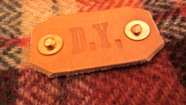 damnyak handcrafted pouch leather logo with copper rivets