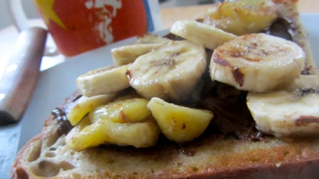butter roasted bread with nutella and banana - ready to eat ! what a breakfast
