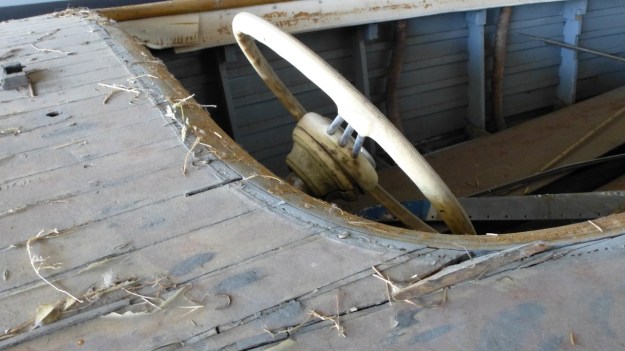 old stuff around the shipyard - steering wheel mahogany boat