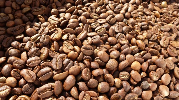 Homeroasted coffee and fresh bread - roasted beans for espresso